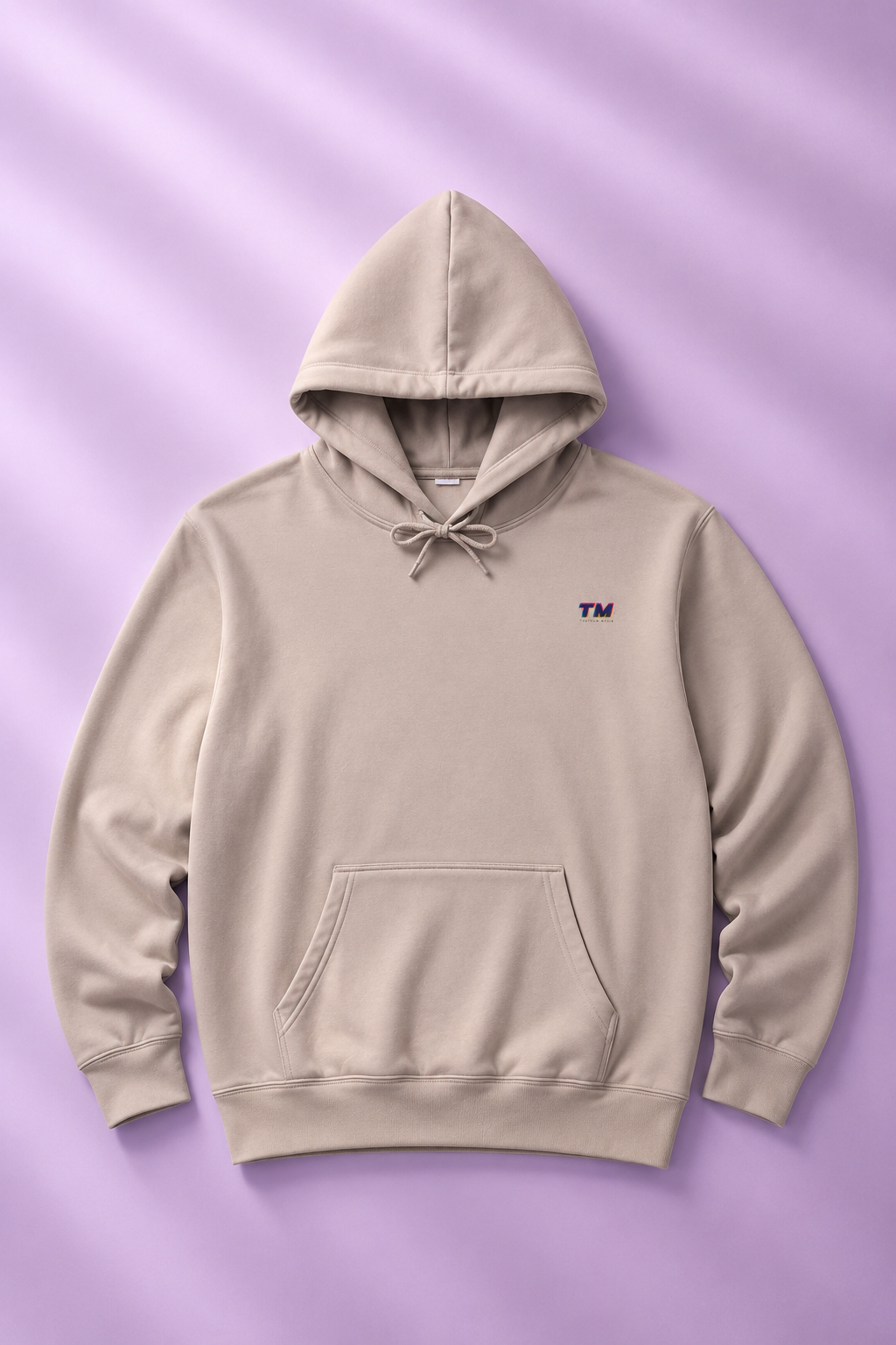 Tantrum Media EcoSmart sand hoodie flat lay on a soft lavender pastel background.