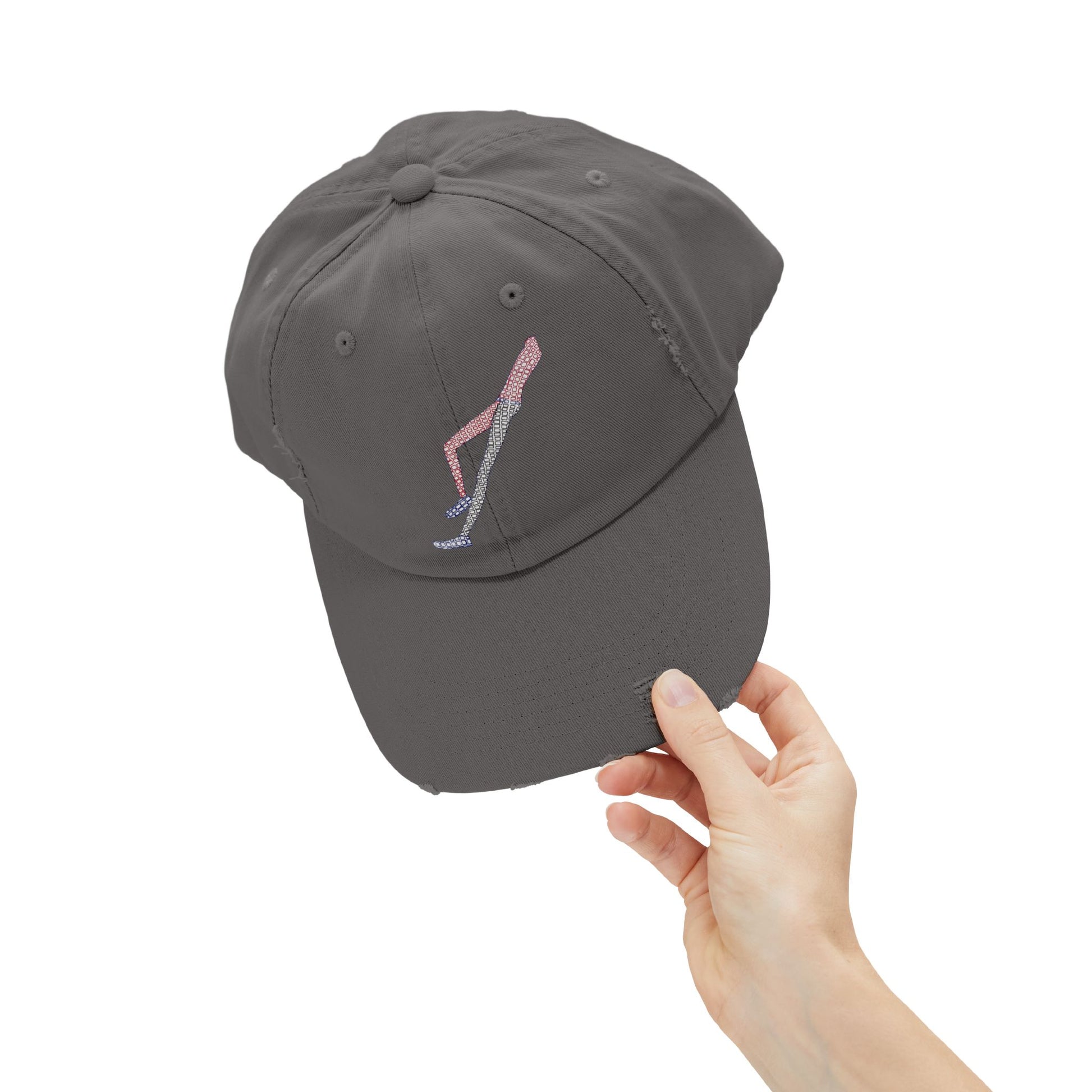 Close-up detail of Shapes in Shapes grey distressed baseball cap highlighting embroidered artwork.