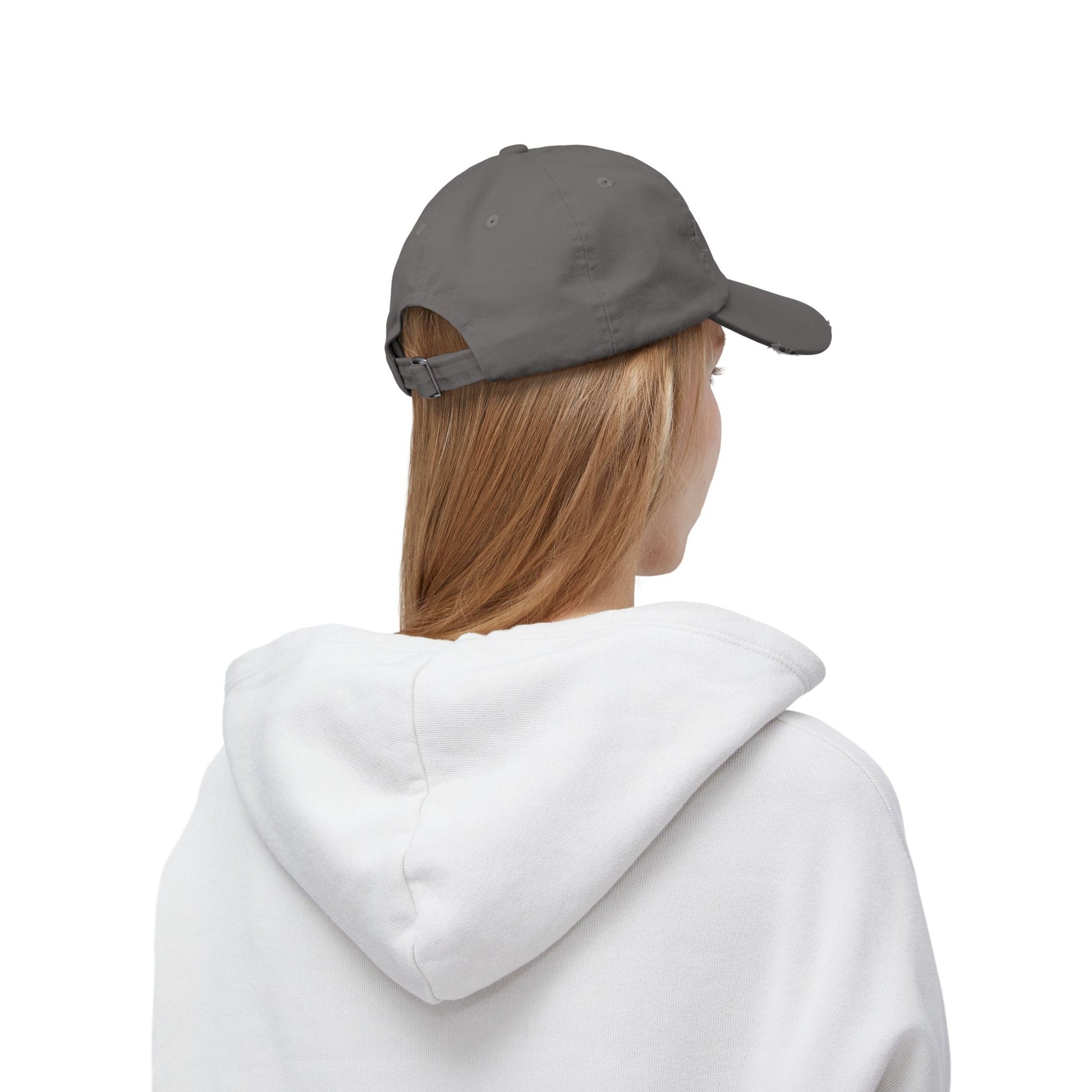 Back view of female model wearing Shapes in Shapes grey distressed baseball cap.