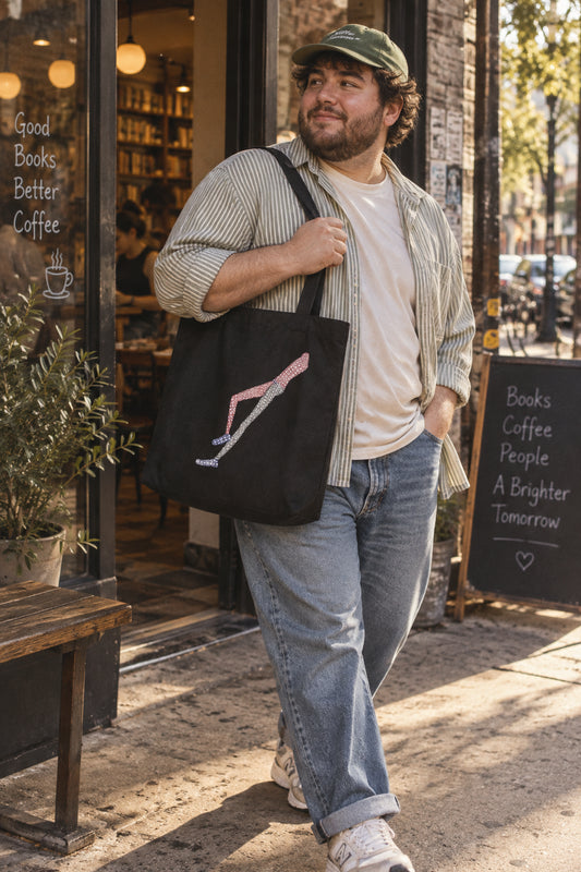 Shapes in Shapes organic cotton art tote bag carried in an everyday city lifestyle scene