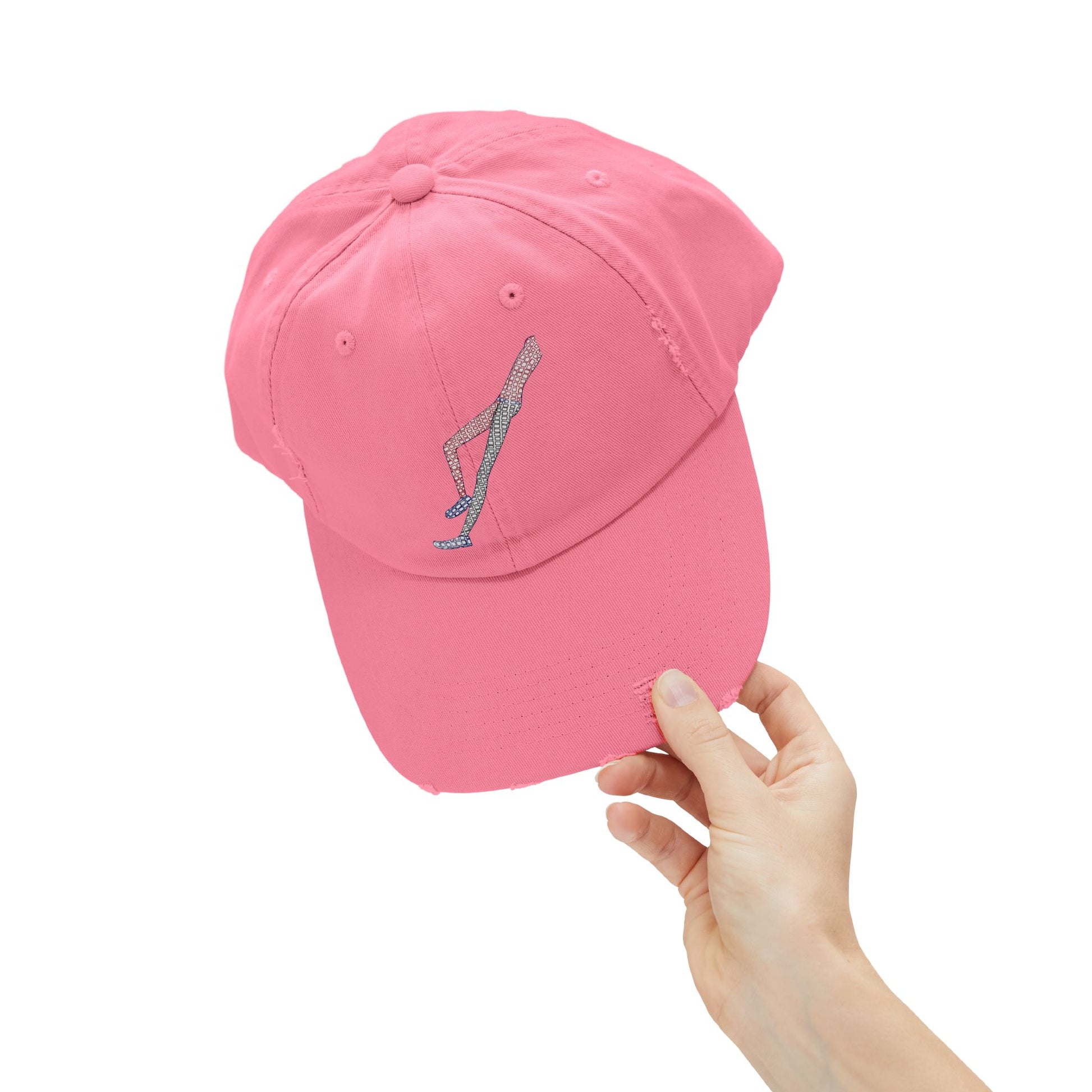 Close-up of Shapes in Shapes pink distressed baseball cap showcasing embroidered artwork and distressed details.