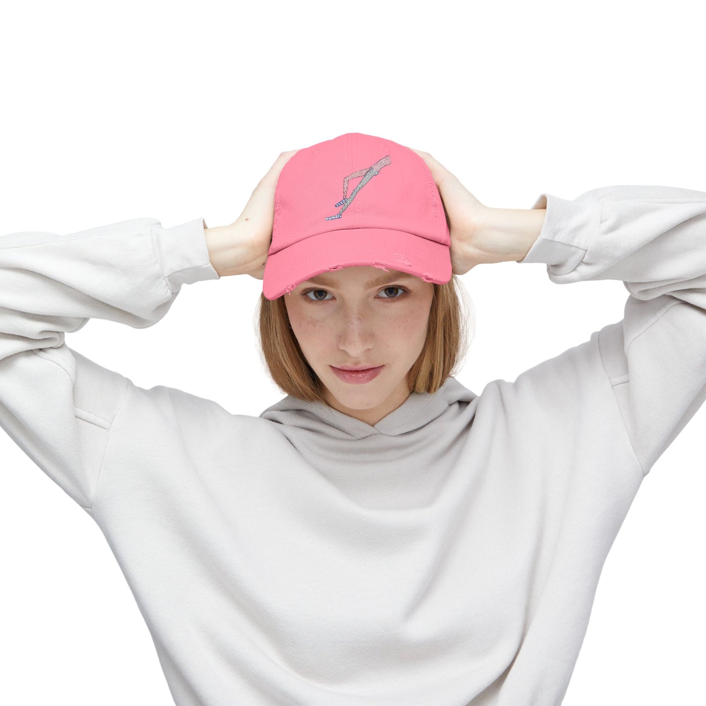 Female model wearing Shapes in Shapes pink distressed baseball cap with original embroidered artwork.