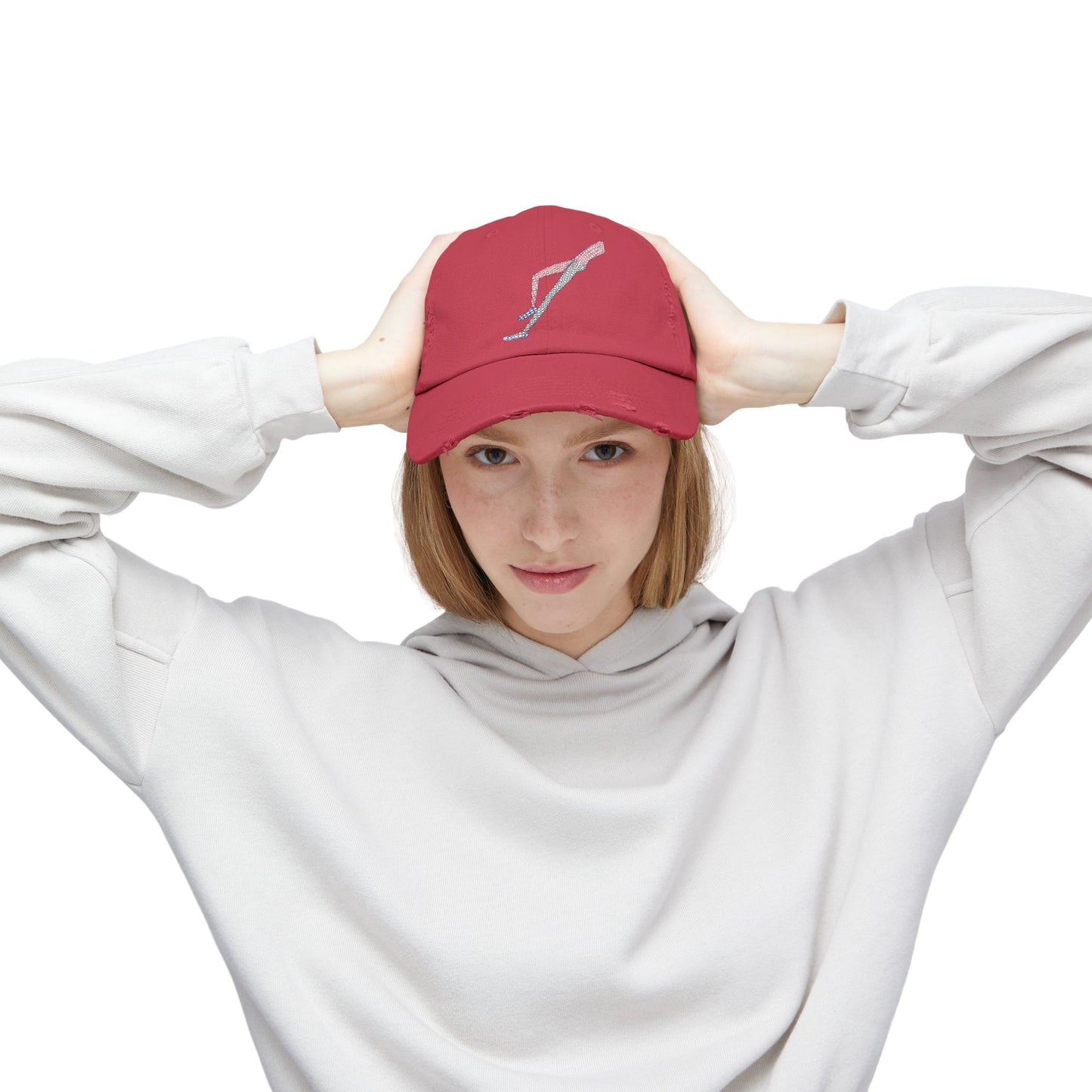 Female model wearing Shapes in Shapes red distressed baseball cap with original embroidered artwork.