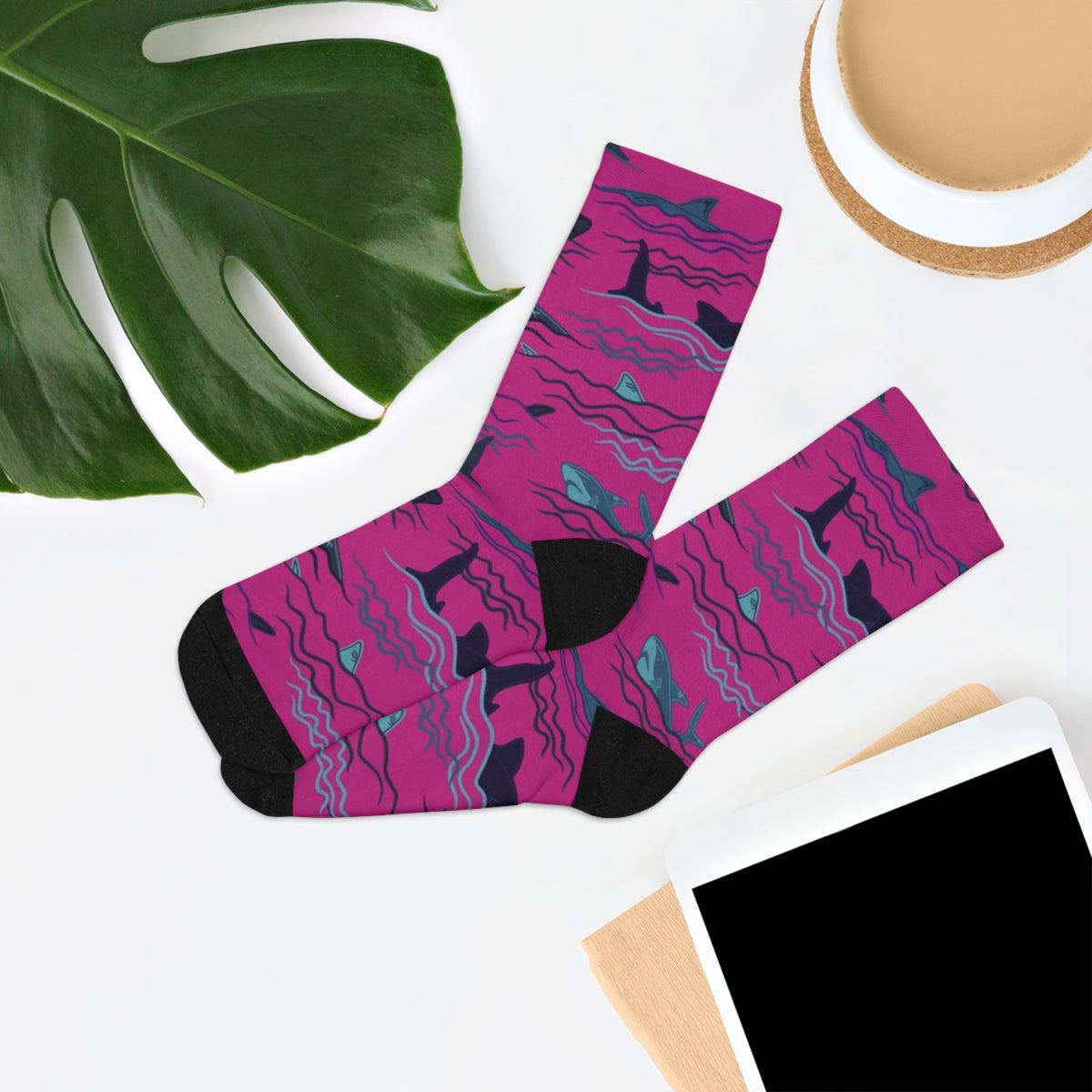 Sharks & Friends shark print crew socks in an editorial flat lay with greenery and desk accessories.
