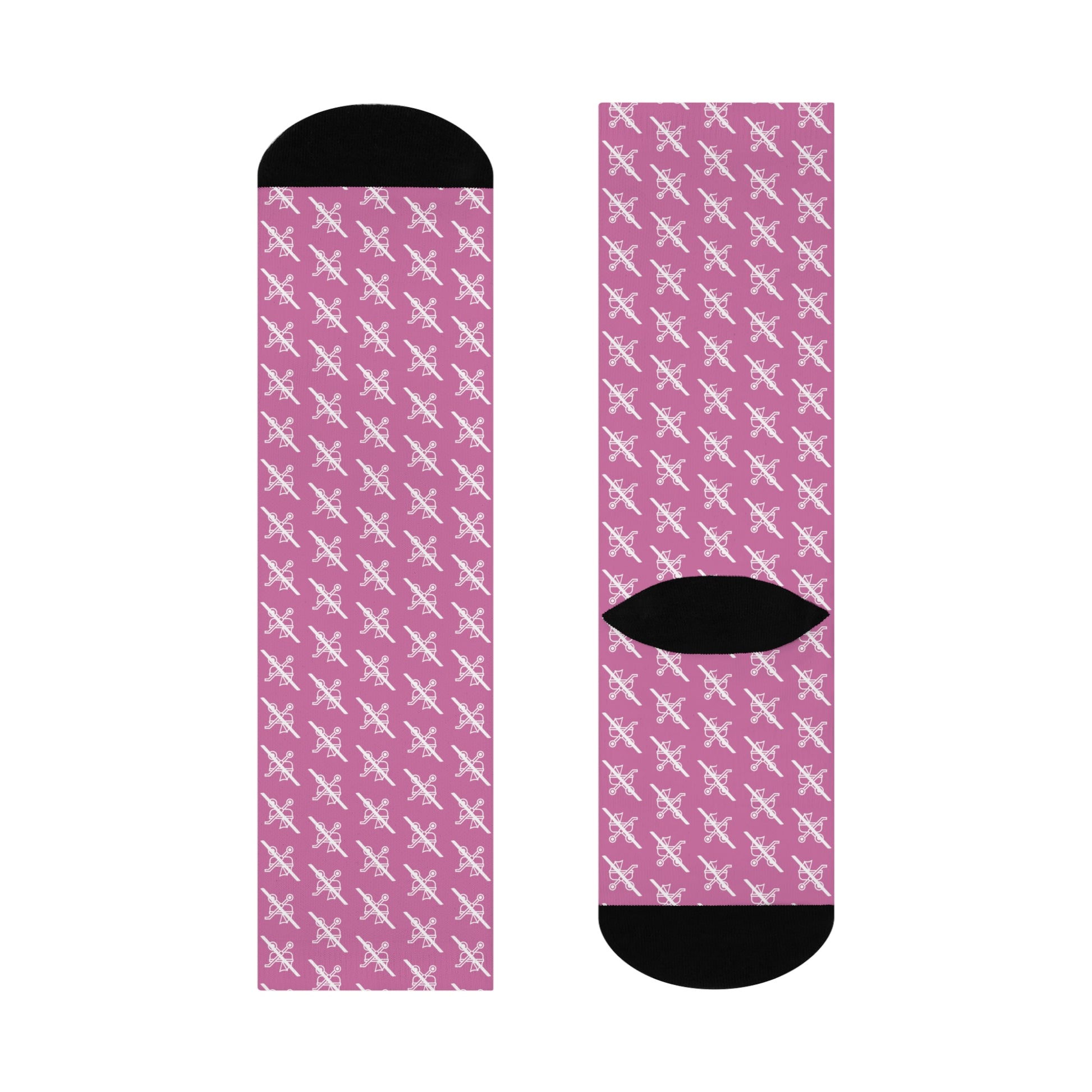 Flat lay of single pink Proudly Childless crew sock front and back with black accents