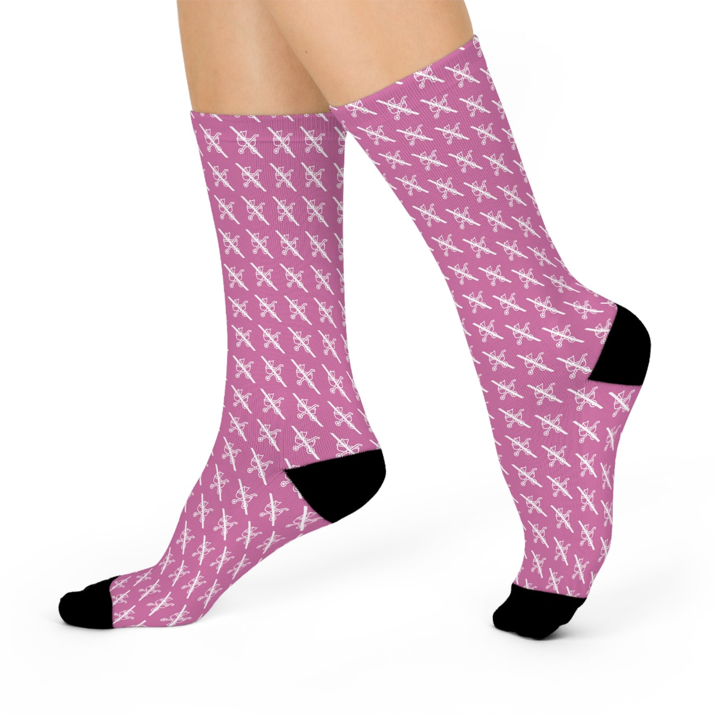Side angle of Proudly Childless pink crew socks showing pattern and black details