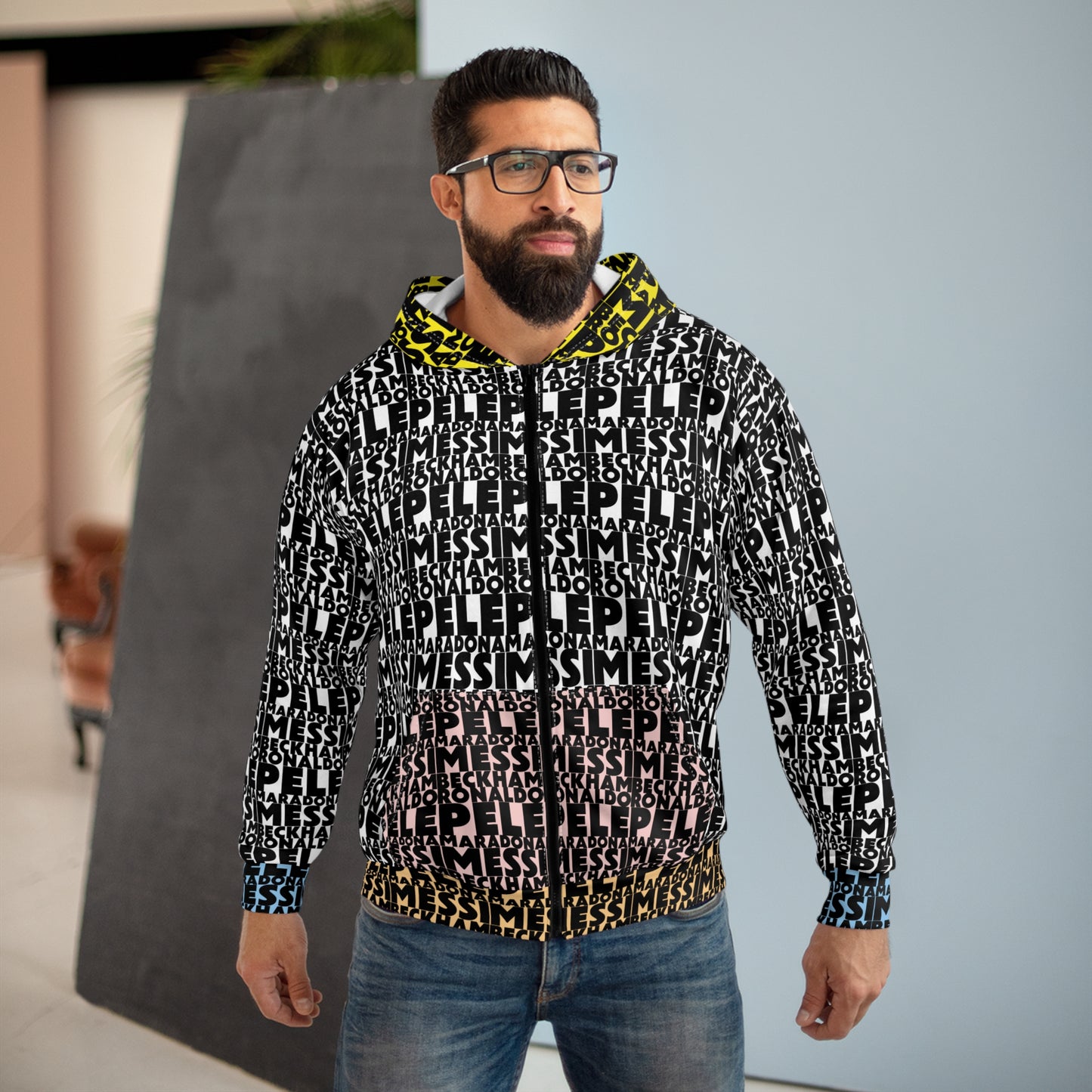 Male wearing soccer legends graphic zip hoodie featuring Messi Ronaldo Maradona Beckham Pele soccer typography design