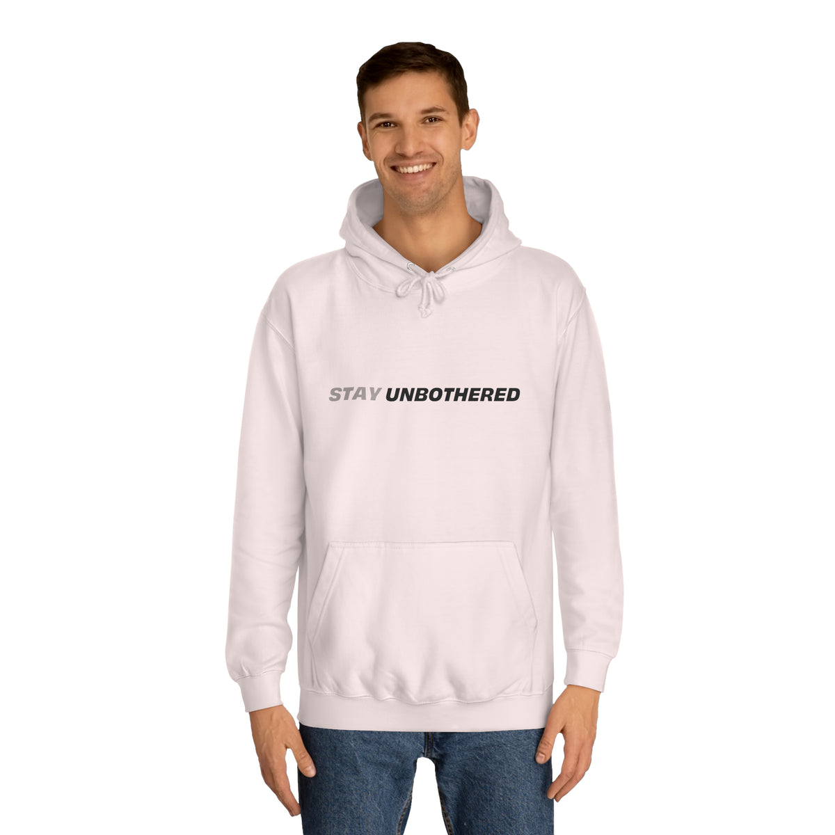 Male model wearing the light pink Stay Unbothered statement hoodie.