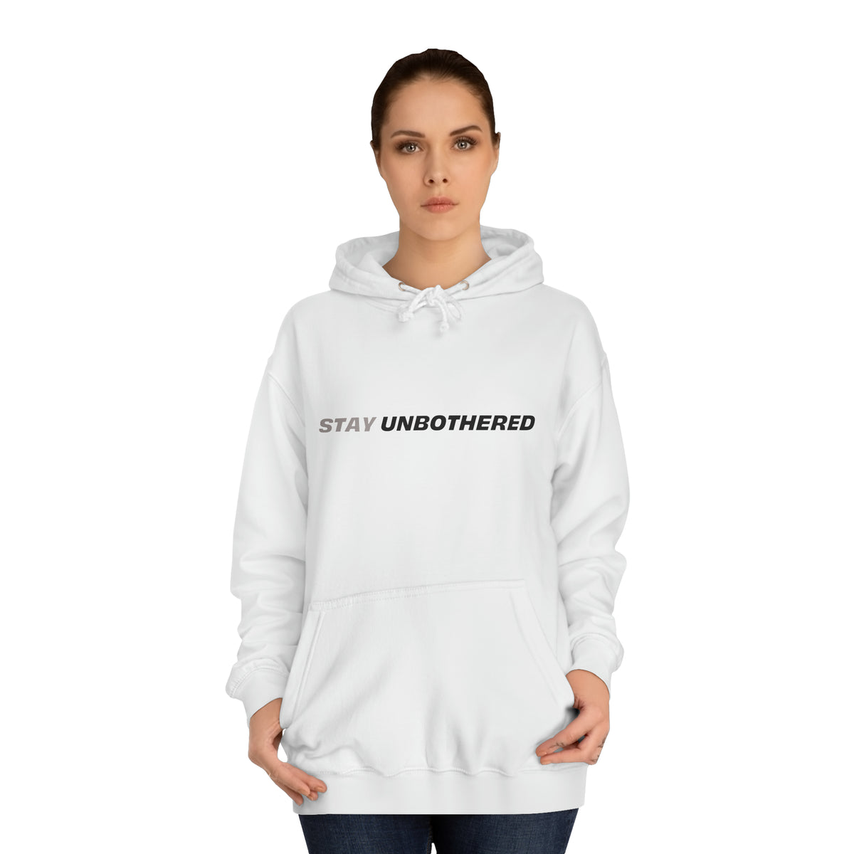 Female model wearing the white Stay Unbothered graphic pullover hoodie.