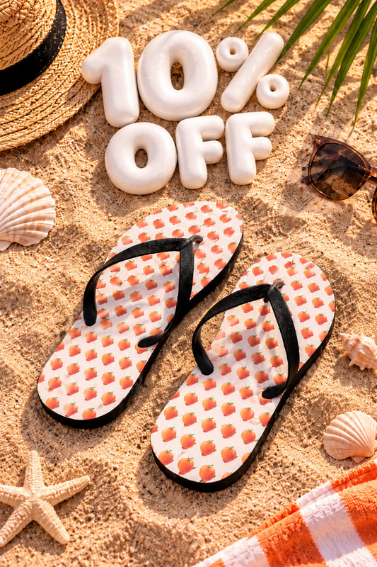 Summer Stuff Sale 10% off featuring peach print flip flops in a sunny editorial beach flat lay