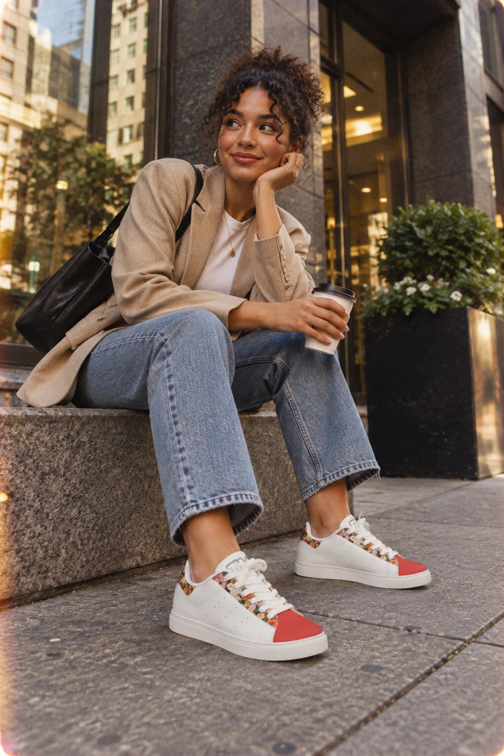 Gen Z woman wearing Tantrum 02 floral women’s low-top leather sneakers in an urban setting