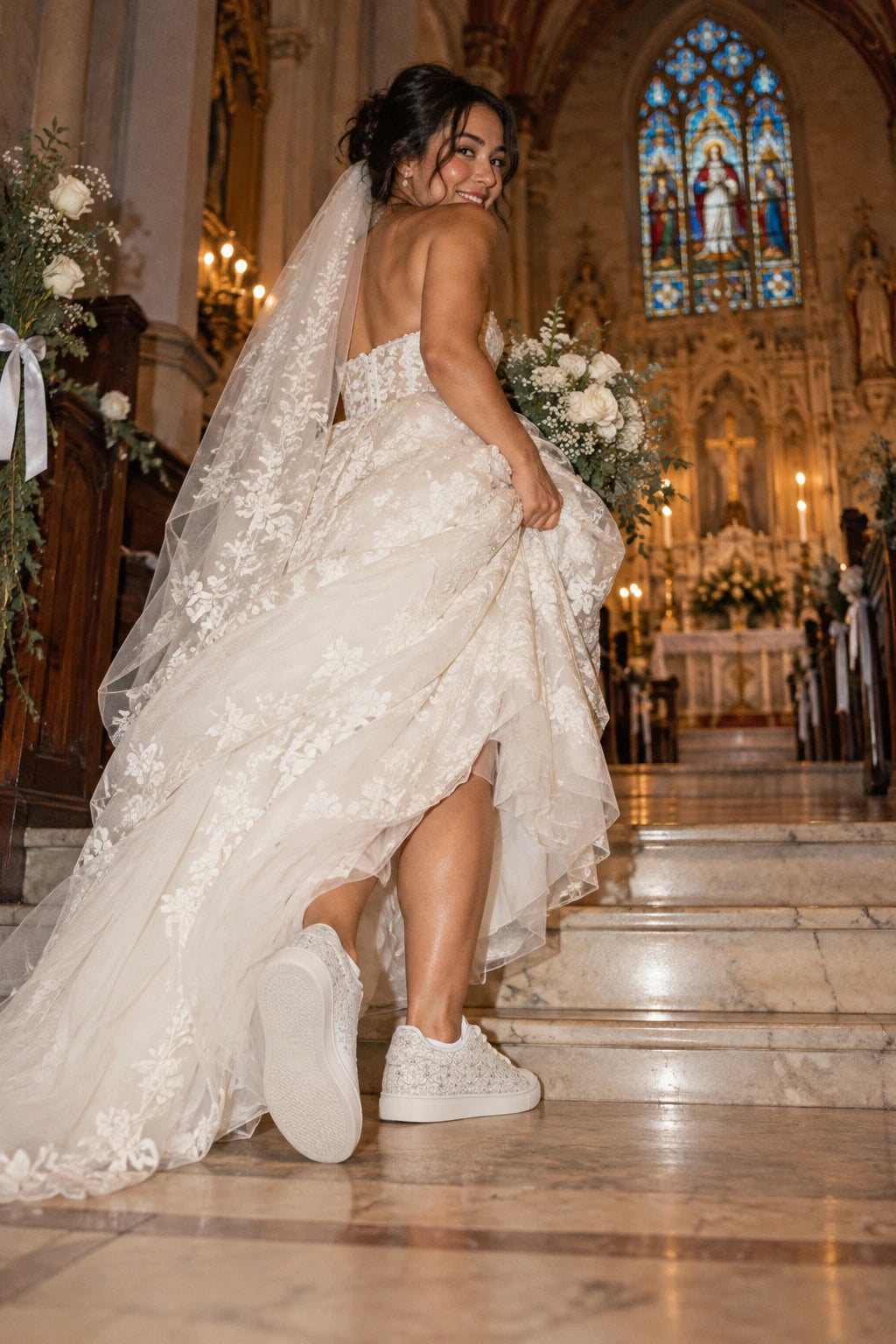 Bride wearing Tantrum 04 women’s bridal lace wedding sneakers inside a church