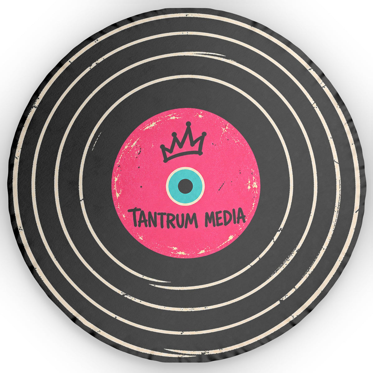 Tantrum Media LP Record Pillow front view showing a round black vinyl record design with distressed cream grooves, pink center label and crown graphic.