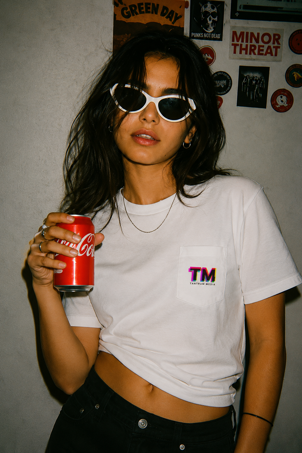 Gen Z woman wearing the Tantrum Media Premium Pocket T-Shirt in a bold editorial-inspired setting.