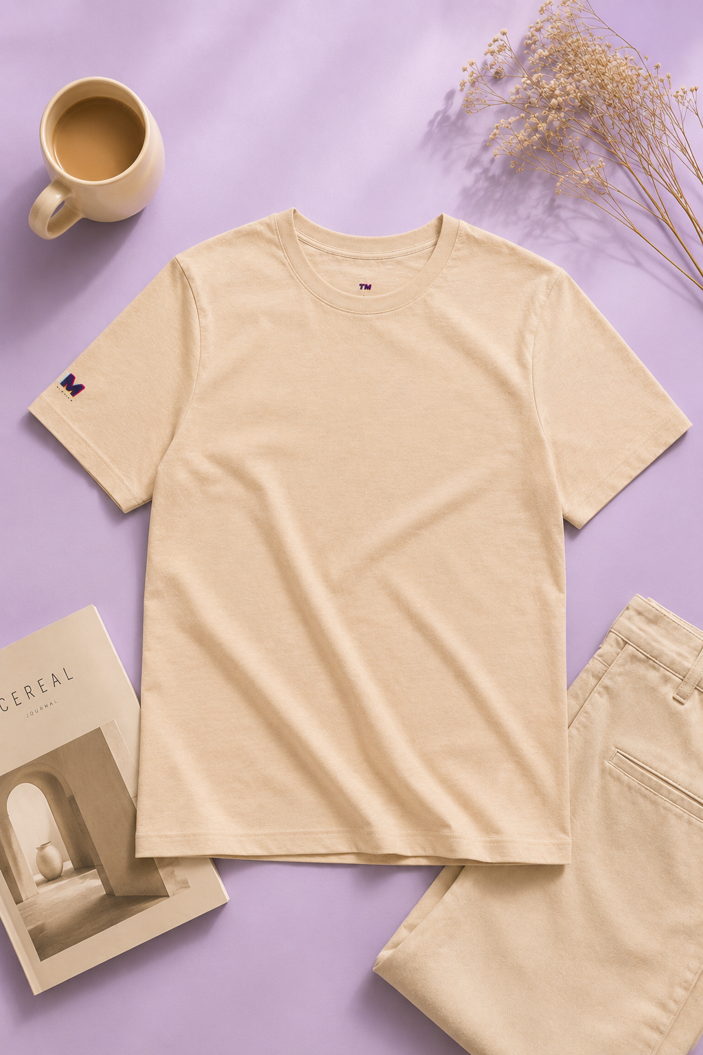 Tantrum Media Soft Tones Plain Tee in sand color flat lay on pastel lavender background
