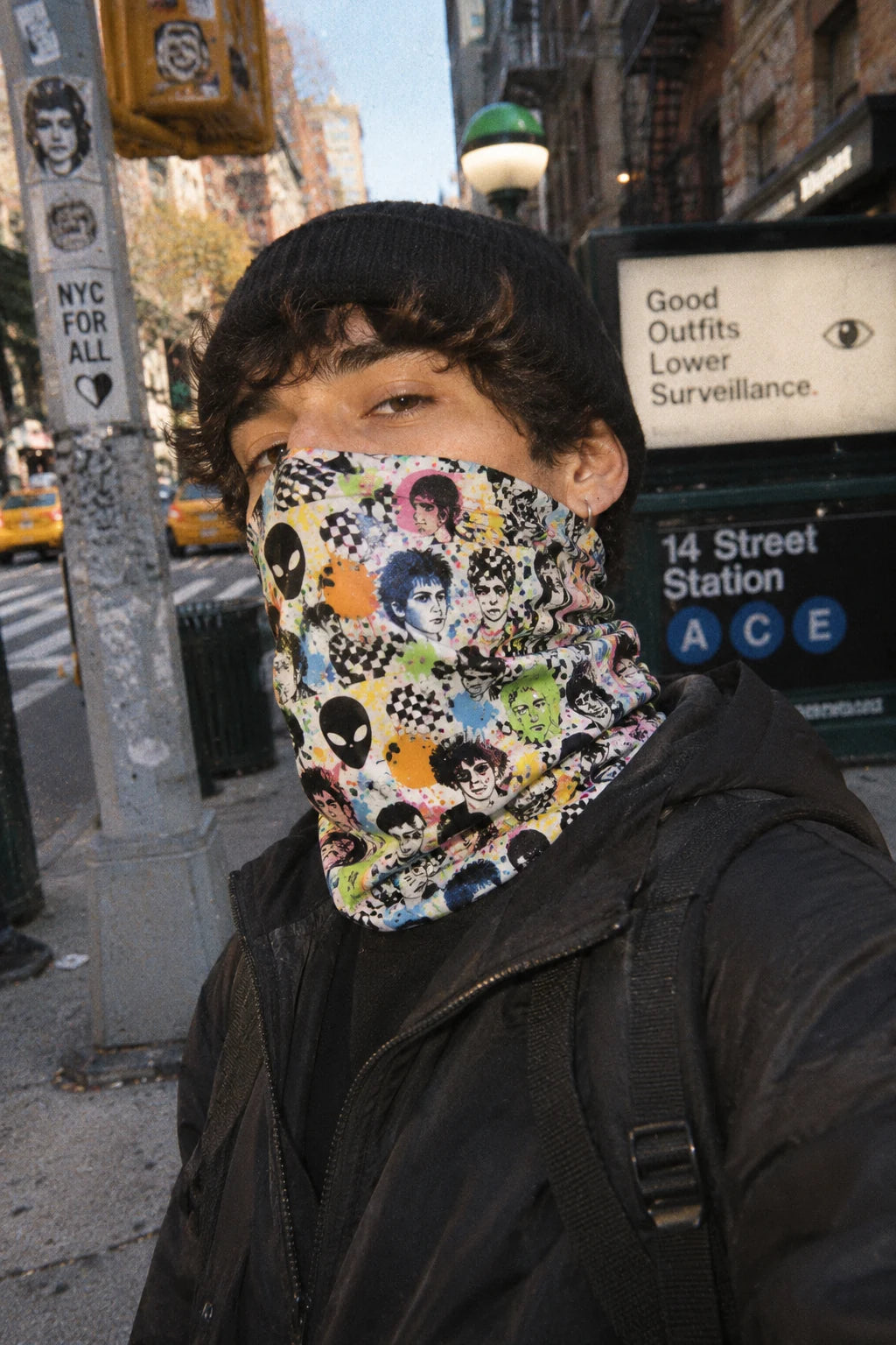 Gen Z man wearing Tech Face adversarial neck gaiter on a NYC street in winter