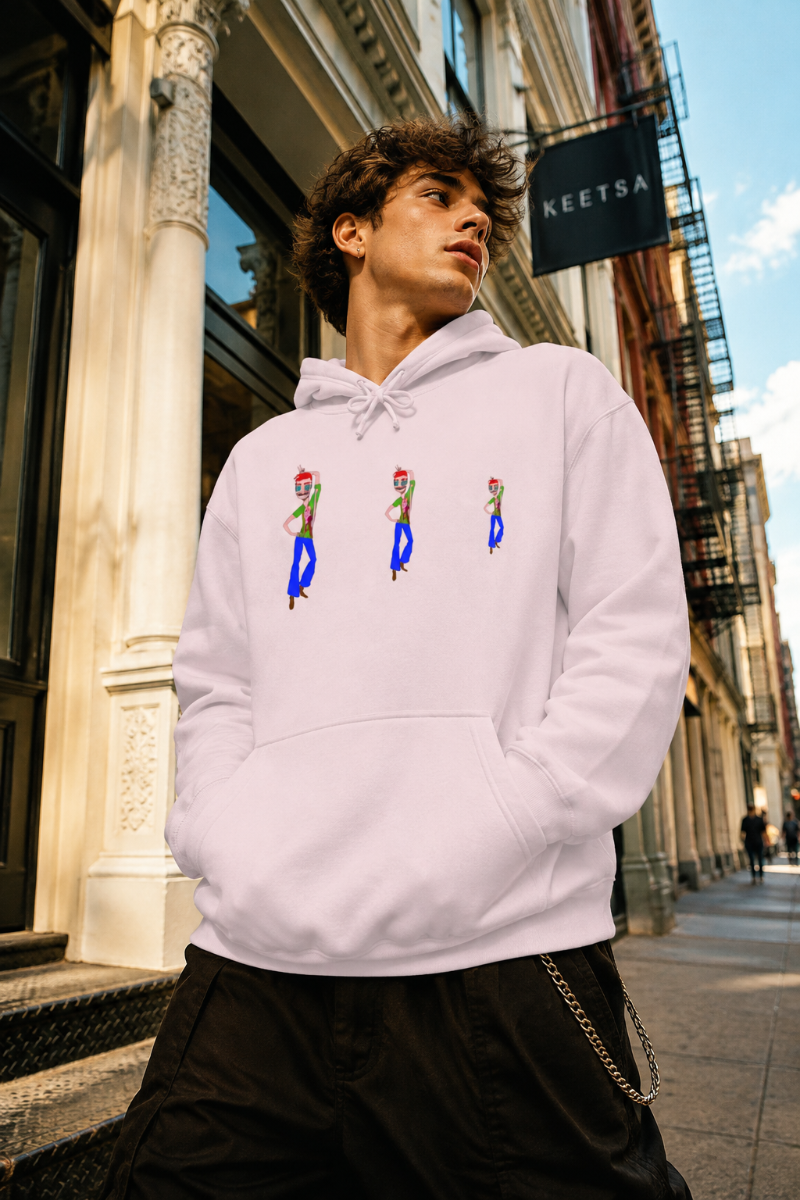 Man wearing a pale pink TeeMan graphic hoodie on a street in SoHo, New York City.