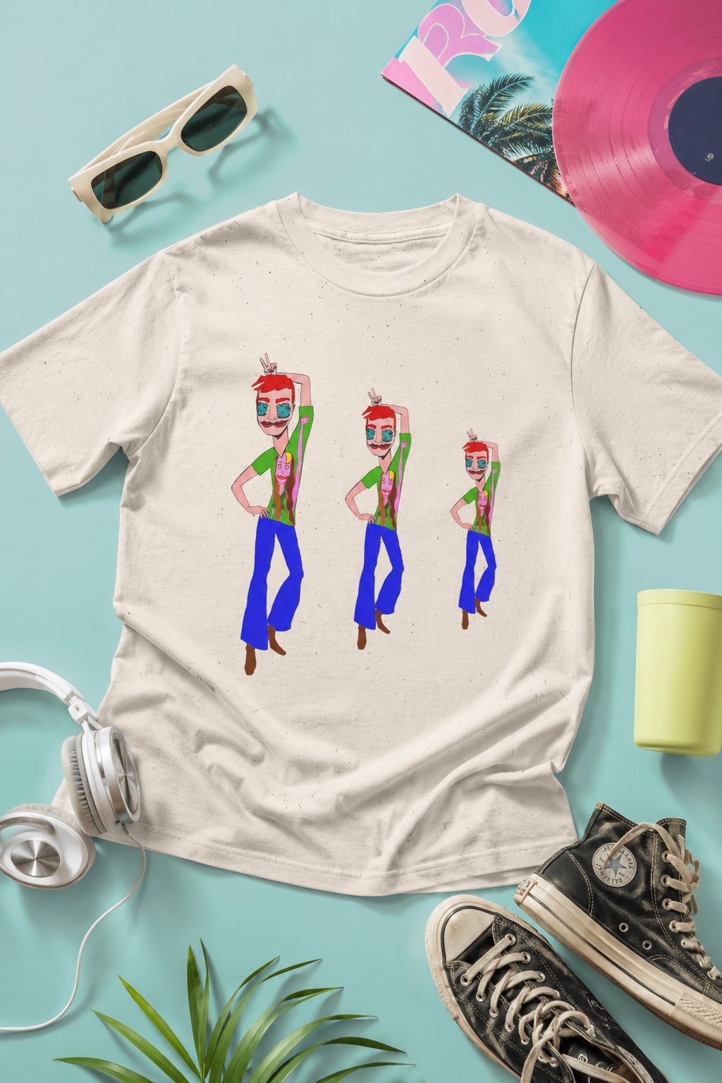 Editorial flat-lay of the TeeMan Graphic T-Shirt featuring original colorful artwork from the Sketchbook Collection.