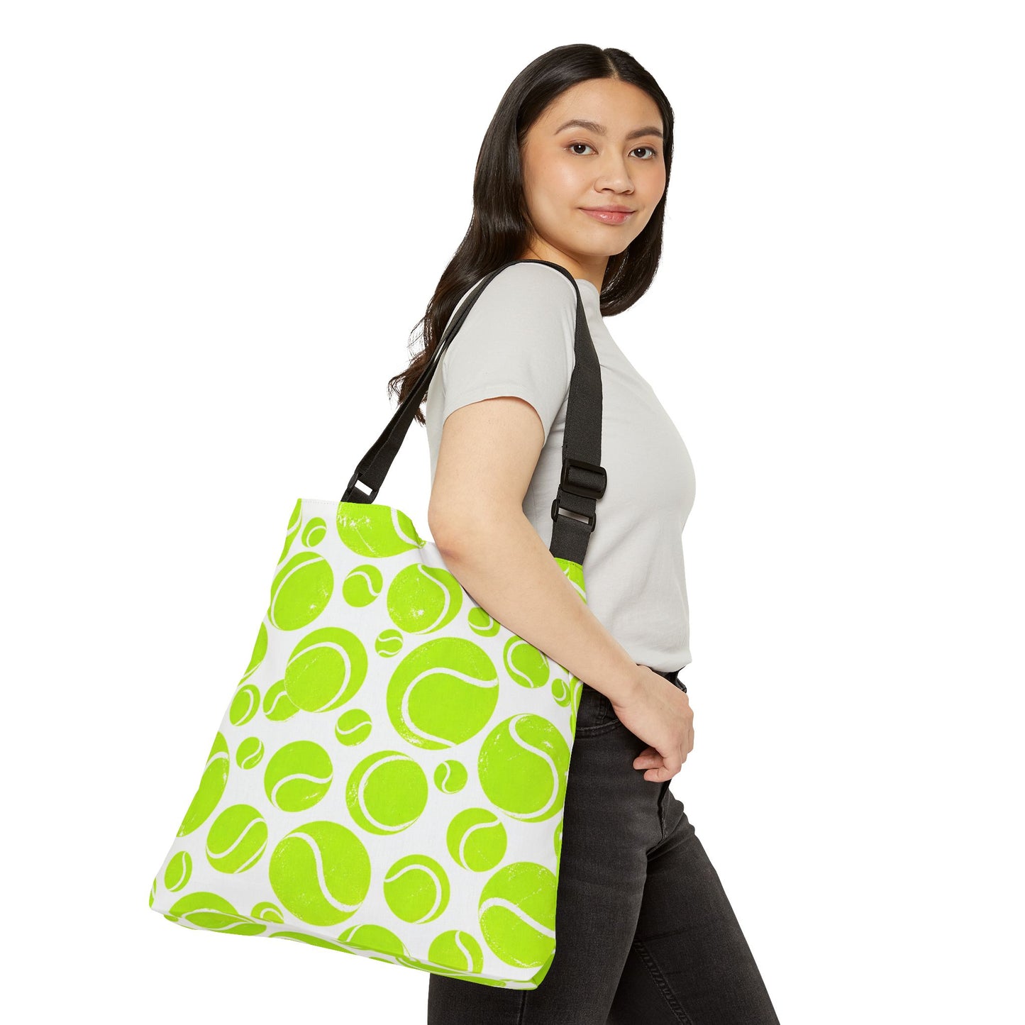Woman carrying neon green tennis ball pattern shoulder tote bag