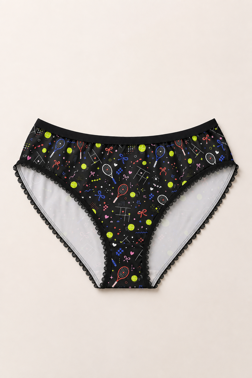 Black tennis print women’s underwear flat lay front view with colorful tennis balls, rackets and graphic details