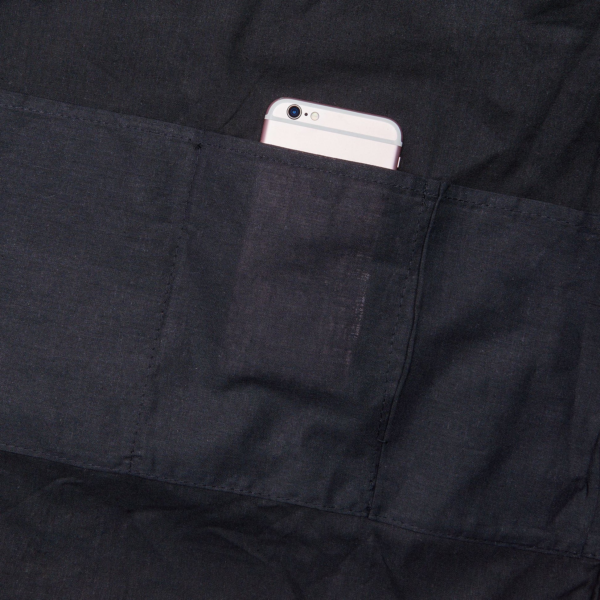 Black interior lining and inner pocket of tennis ball pattern tote bag