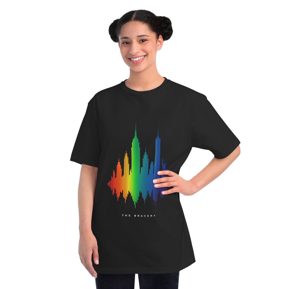 Female model wearing black The Bravery graphic T-shirt with colorful NYC soundwave design