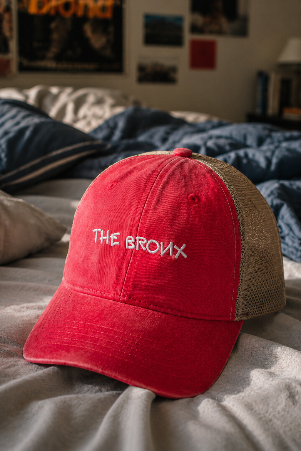 Close-up lifestyle photo of The Bronx vintage red trucker hat.