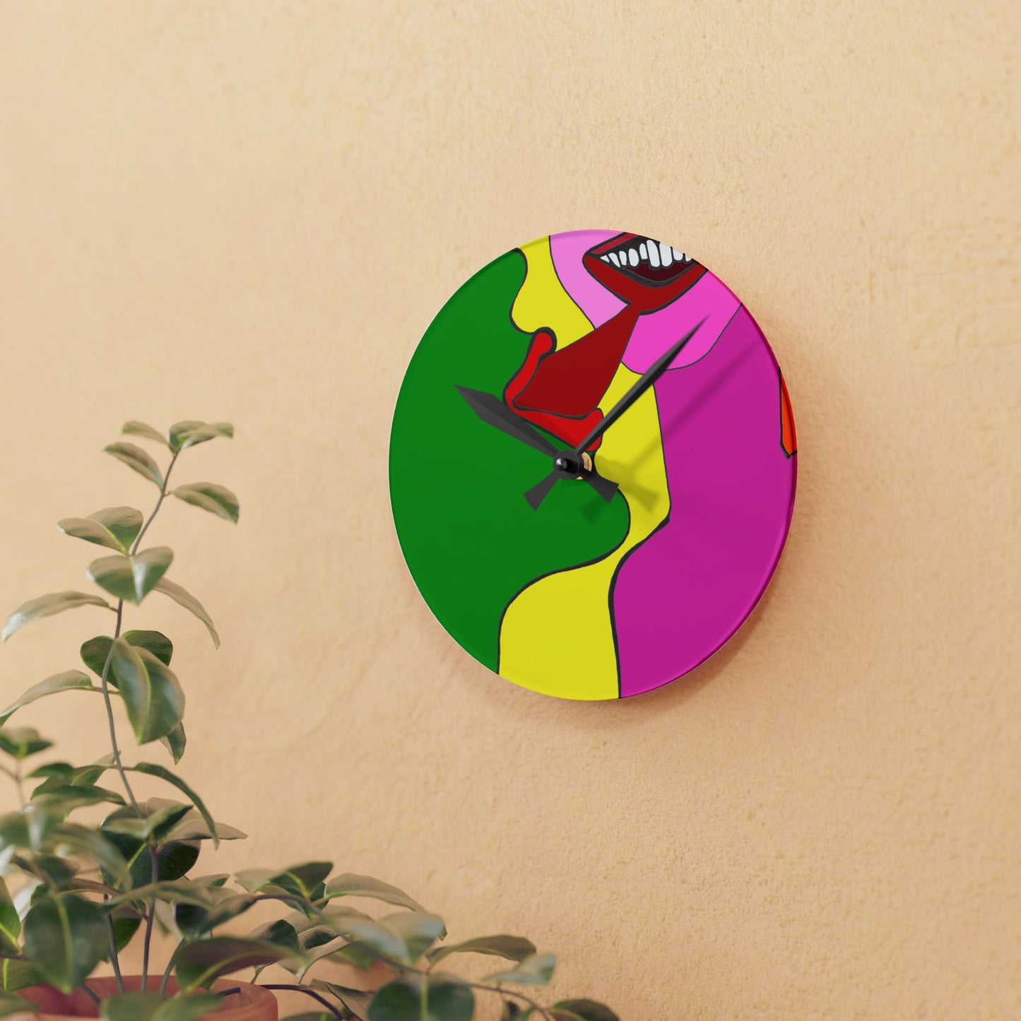 The Kiss original art wall clock styled on a warm neutral wall with indoor plants