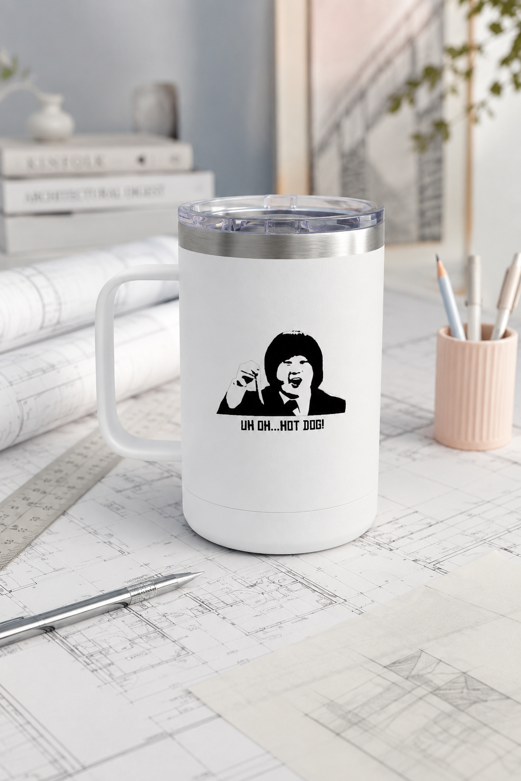 Uh Oh Hot Dog MADtv travel mug on architectural blueprints in a minimalist design studio