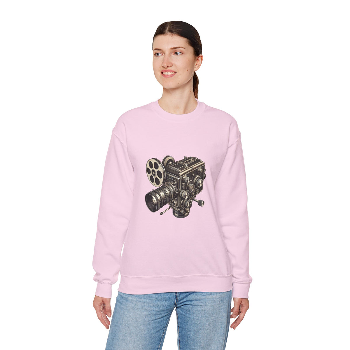 Female model standing in light pink Film Camera Sweatshirt, styled casually.