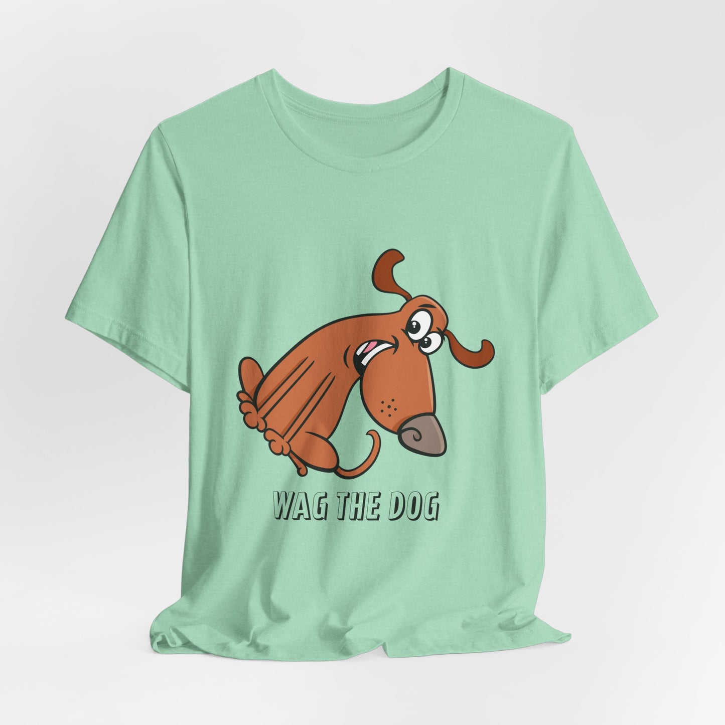 Mint green Wag the Dog graphic t-shirt featuring original cartoon dog artwork and movie-inspired design.