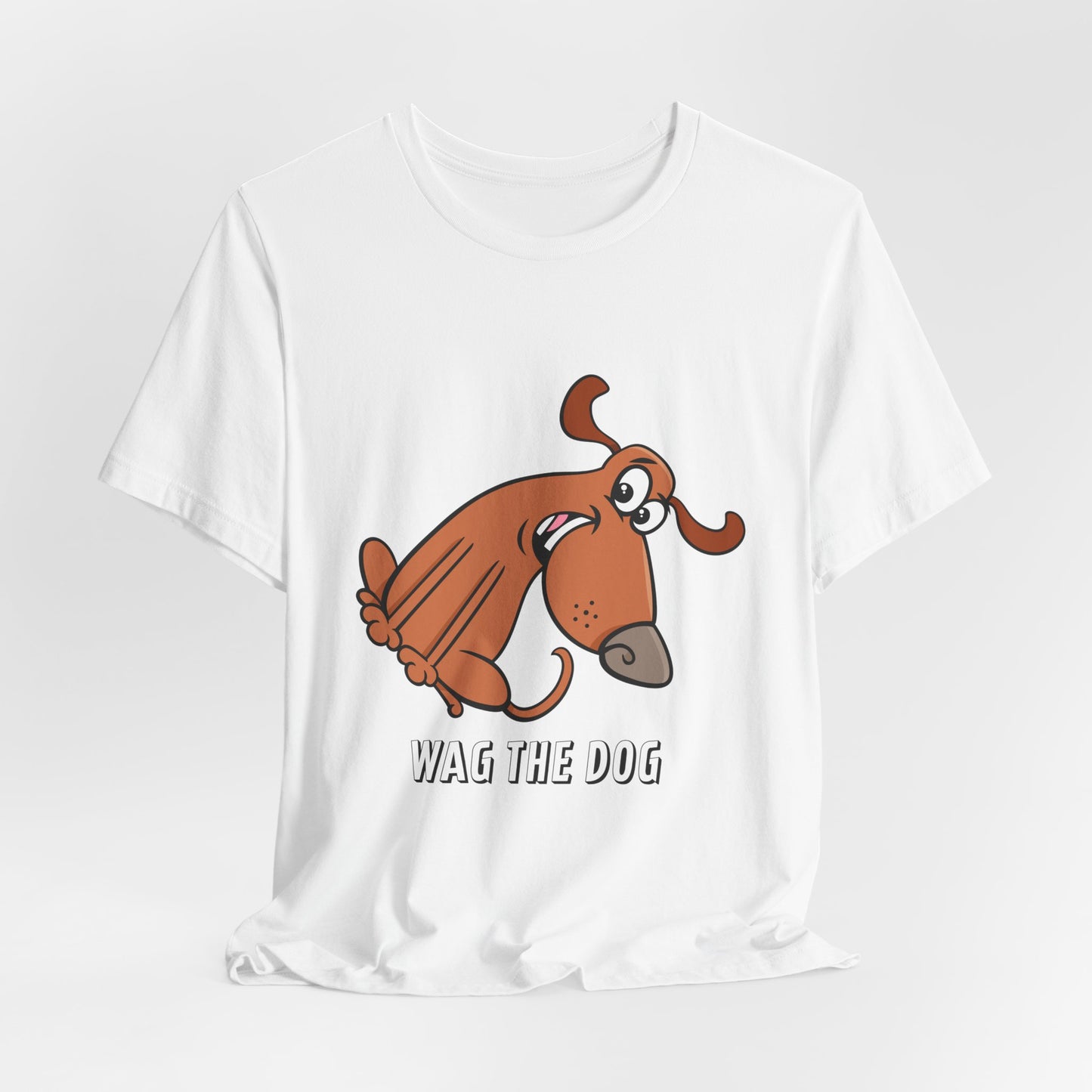 White Wag the Dog graphic t-shirt with original cartoon dog illustration and typography.
