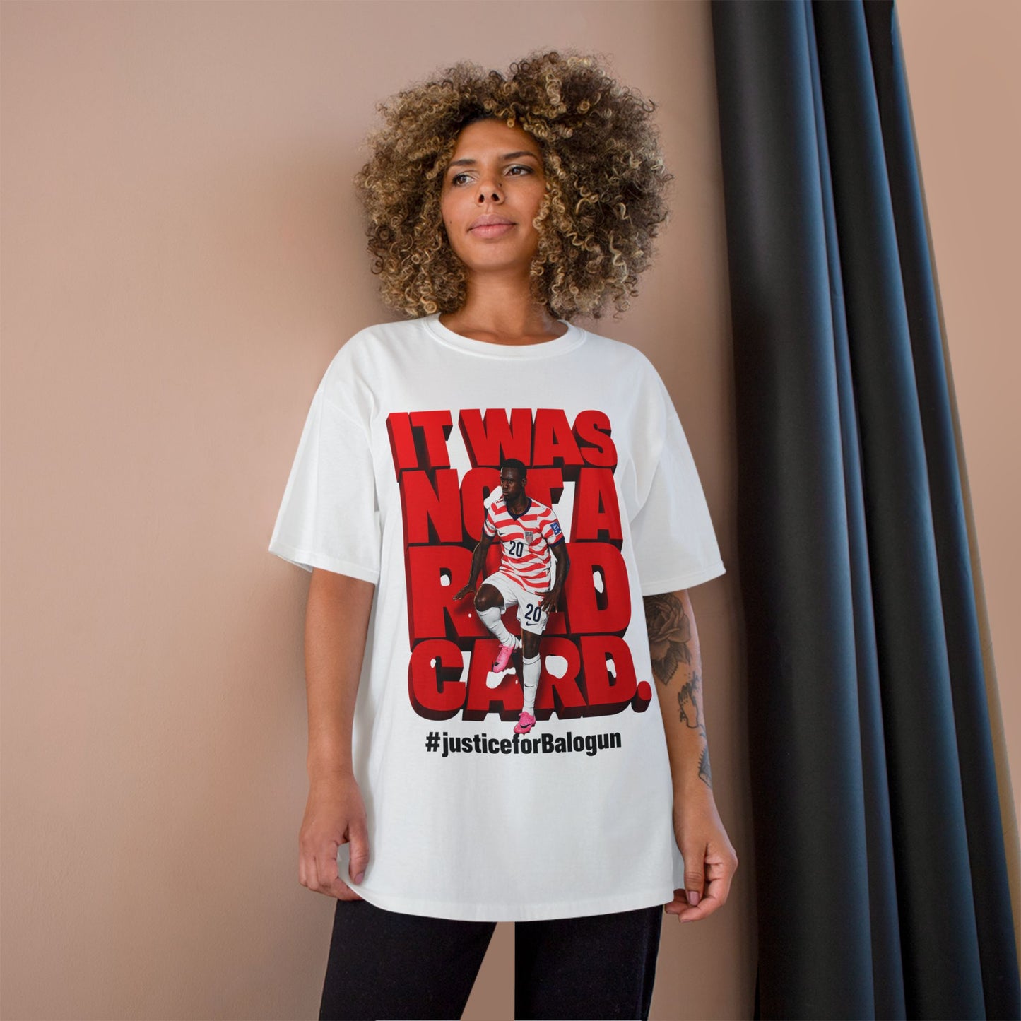 white soccer graphic t-shirt with Balogun protest design front view