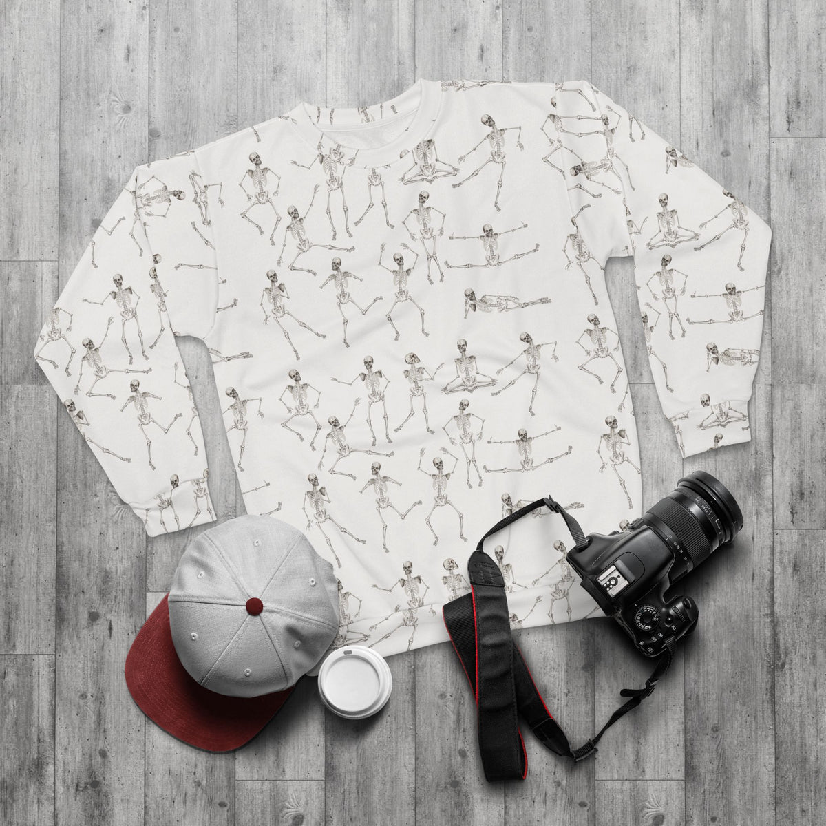 White Dancing Skeletons Sweatshirt styled flat lay with casual accessories and camera