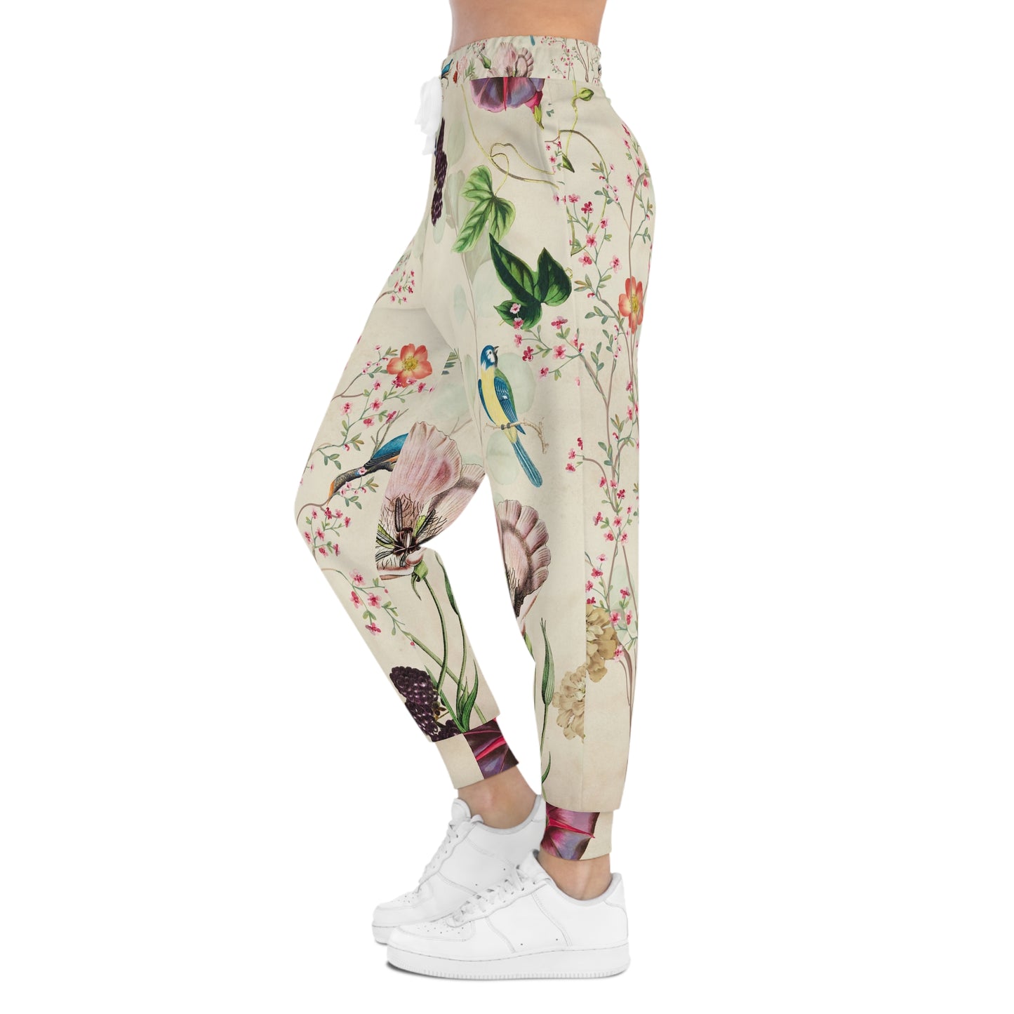 Profile view of Wildflower Meadow Joggers showing nature-inspired floral artwork, cuffed ankles, and soft casual styling.