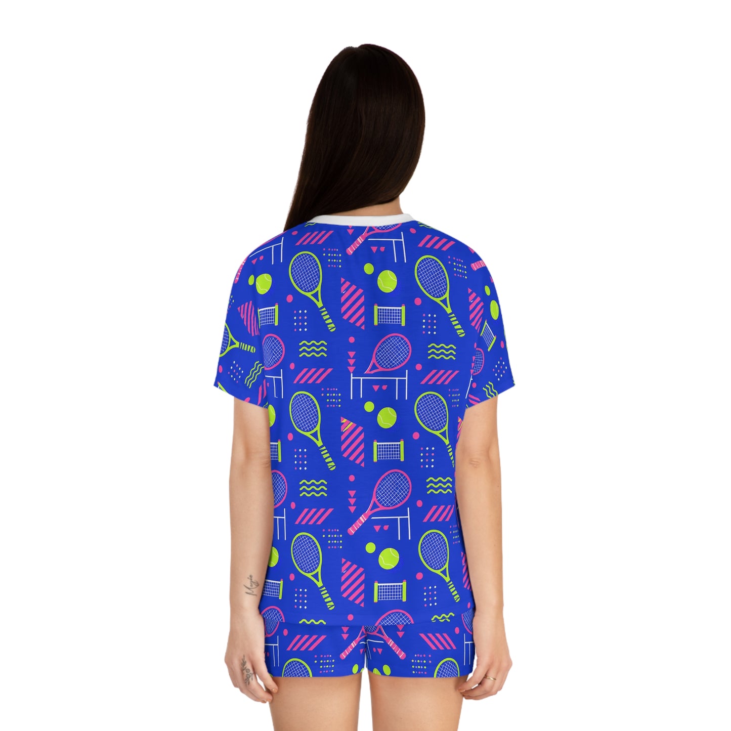 Back view of woman wearing colorful blue tennis short pajama set
