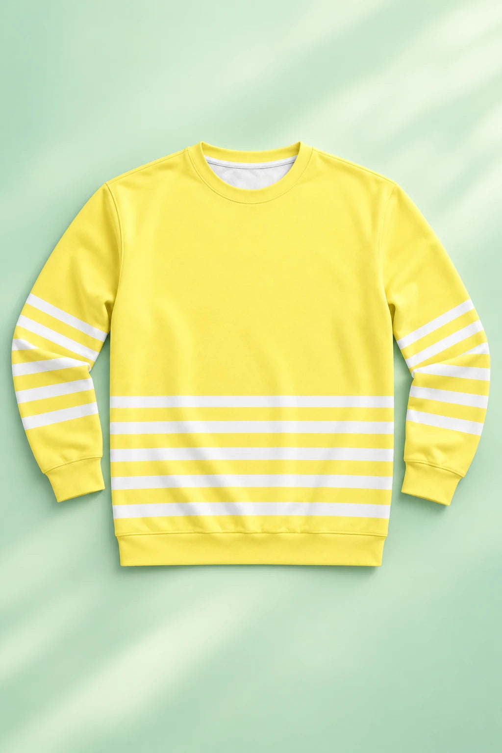 Front flat lay of yellow striped sweatshirt with white horizontal stripes on pastel green background