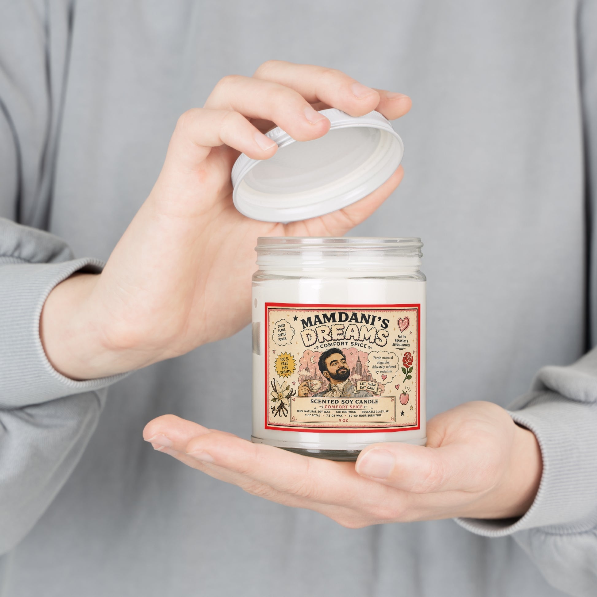 Person holding the Zohran Mamdani’s Dreams 9 oz political satire soy candle